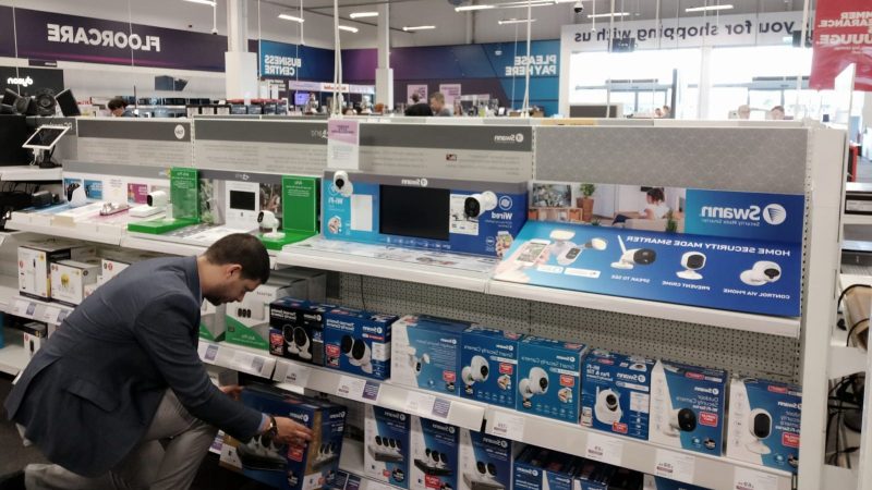 Retail Profiling field team restocking Swann shelf in store as part of the field marketing service, merchandising and compliance