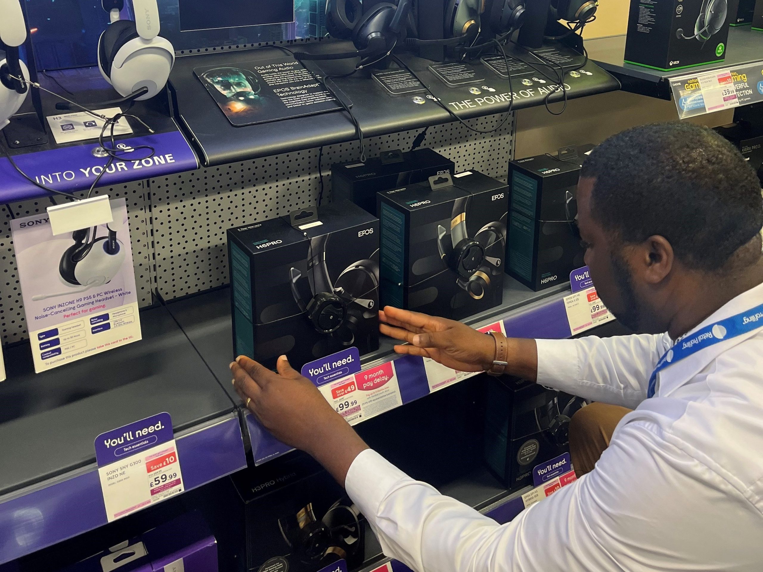 Retail Profiling field team restocking shelves in store as part of the field marketing service, merchandising and compliance