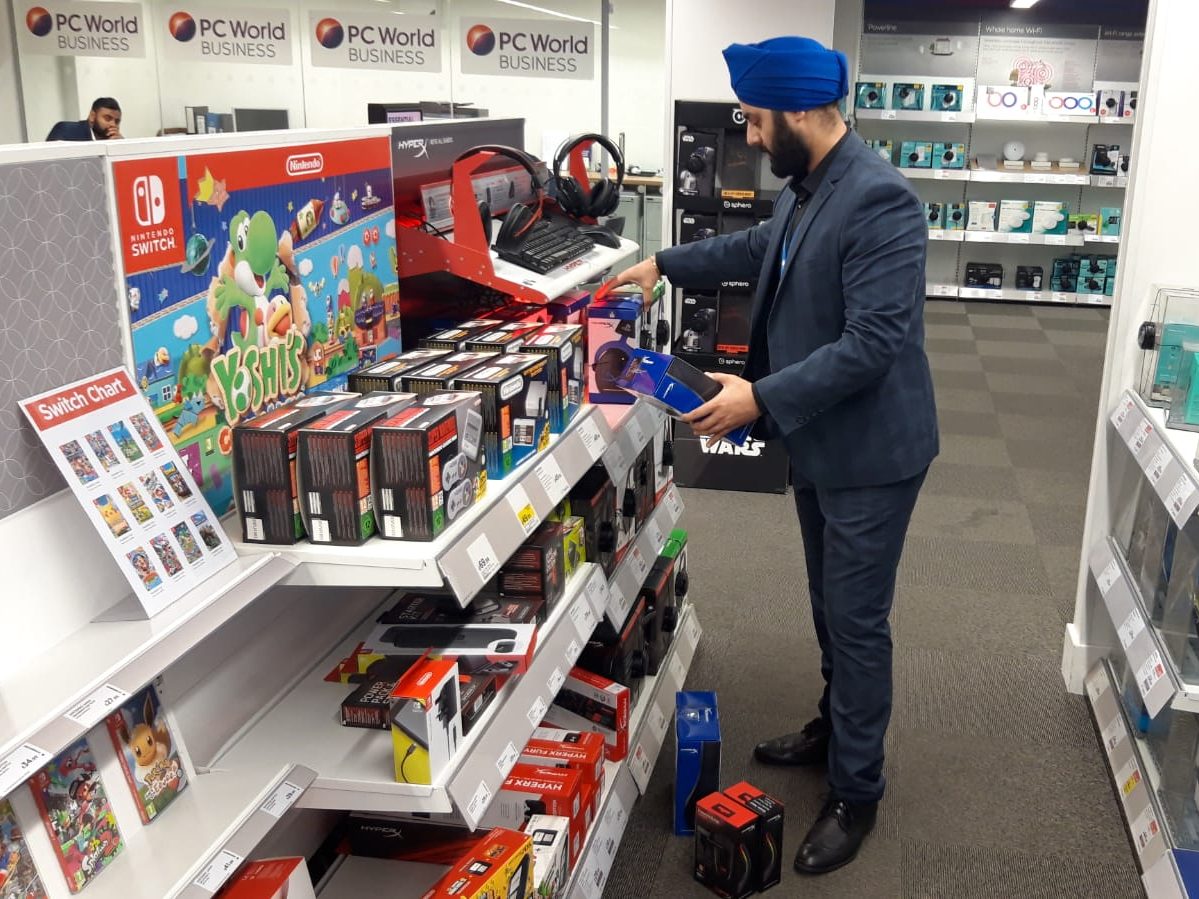 A member of the Retail Profiling field marketing team working in Currys
